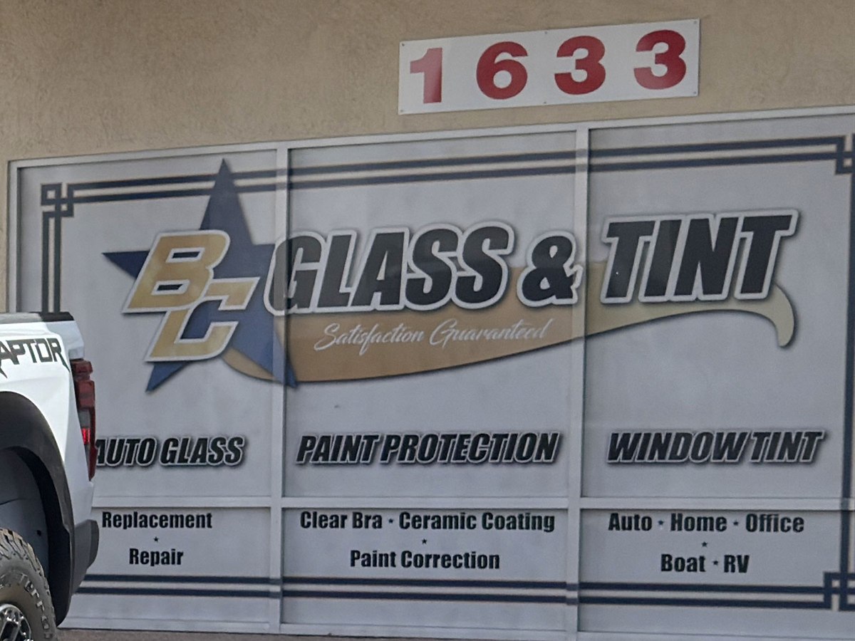 The shop's storefront sign panel for paint protection